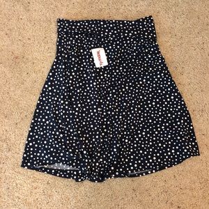 Navy blue polka dot skirt with slight ruffle band